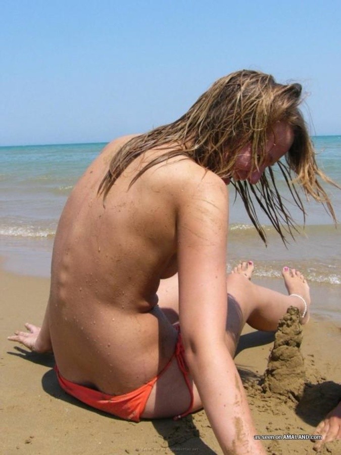 blonde girlfriend doing topless sunbath photo